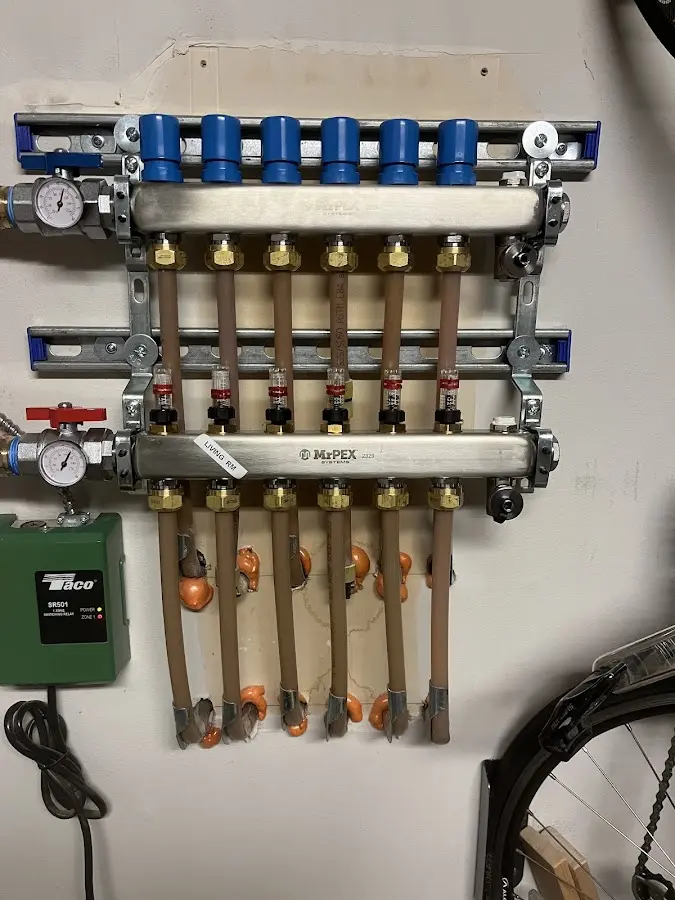 Plumber performing Water Heater Repair at a residential property in Sun Prairie